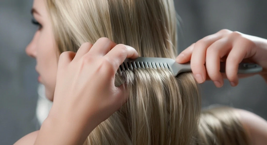 A professional demonstration of brushing XLlifeDoll hair using a wide-tooth comb while supporting the roots to prevent shedding.