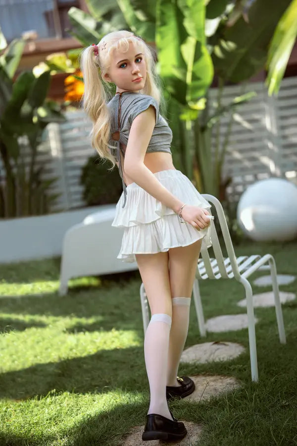 150cm TPE doll Lulu wearing a grey crop top and white tiered skirt