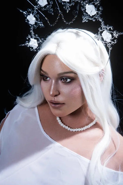 Curvy D-cup silhouette visible through a translucent white gown.